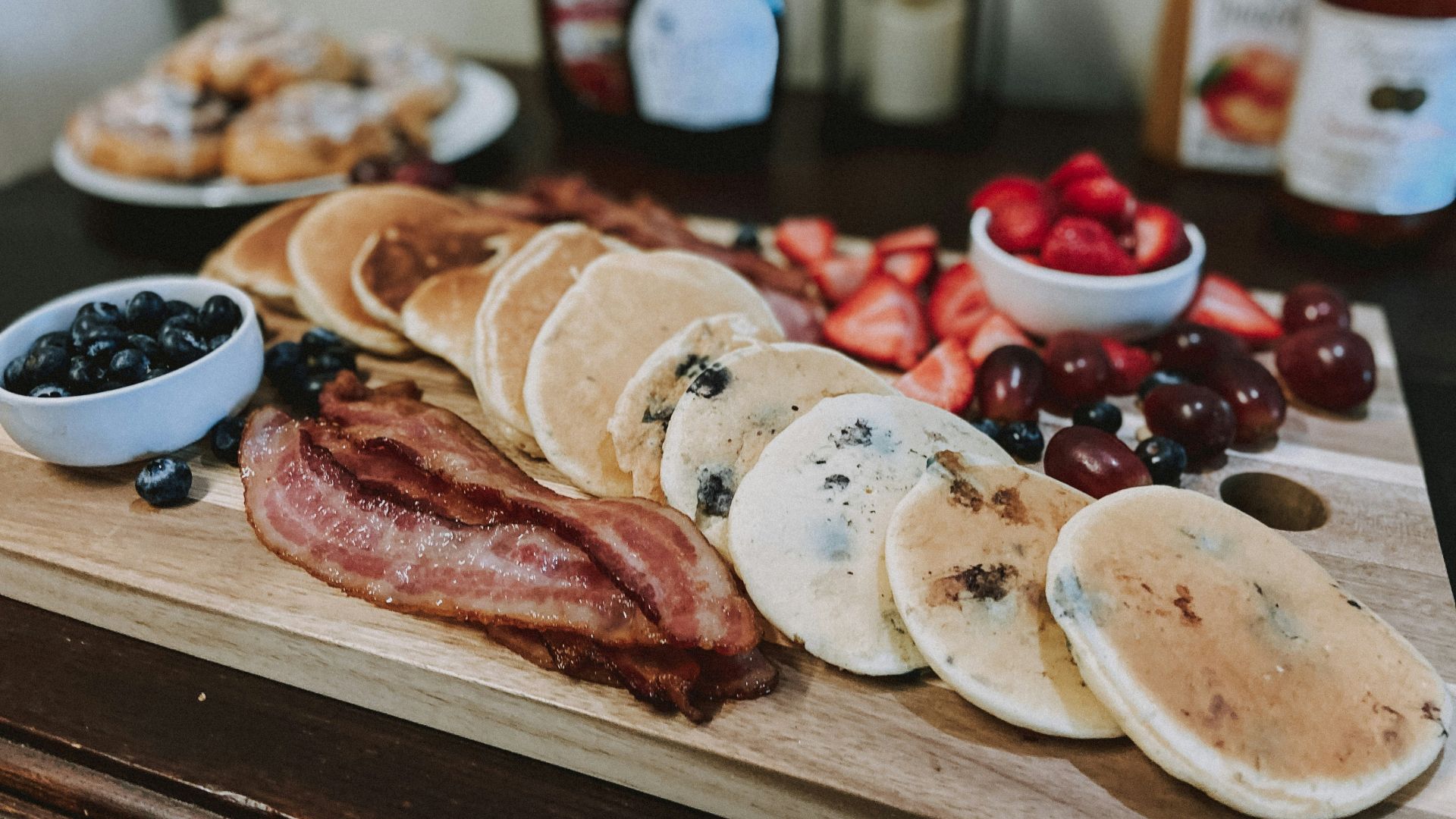 sliced meat on brown wooden chopping board