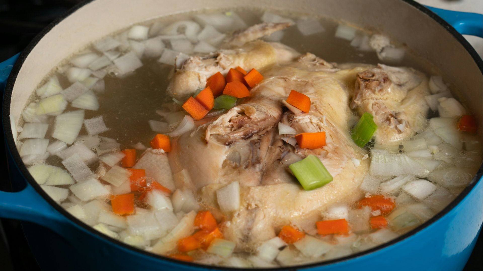 white rice with green peas and carrots in blue ceramic bowl