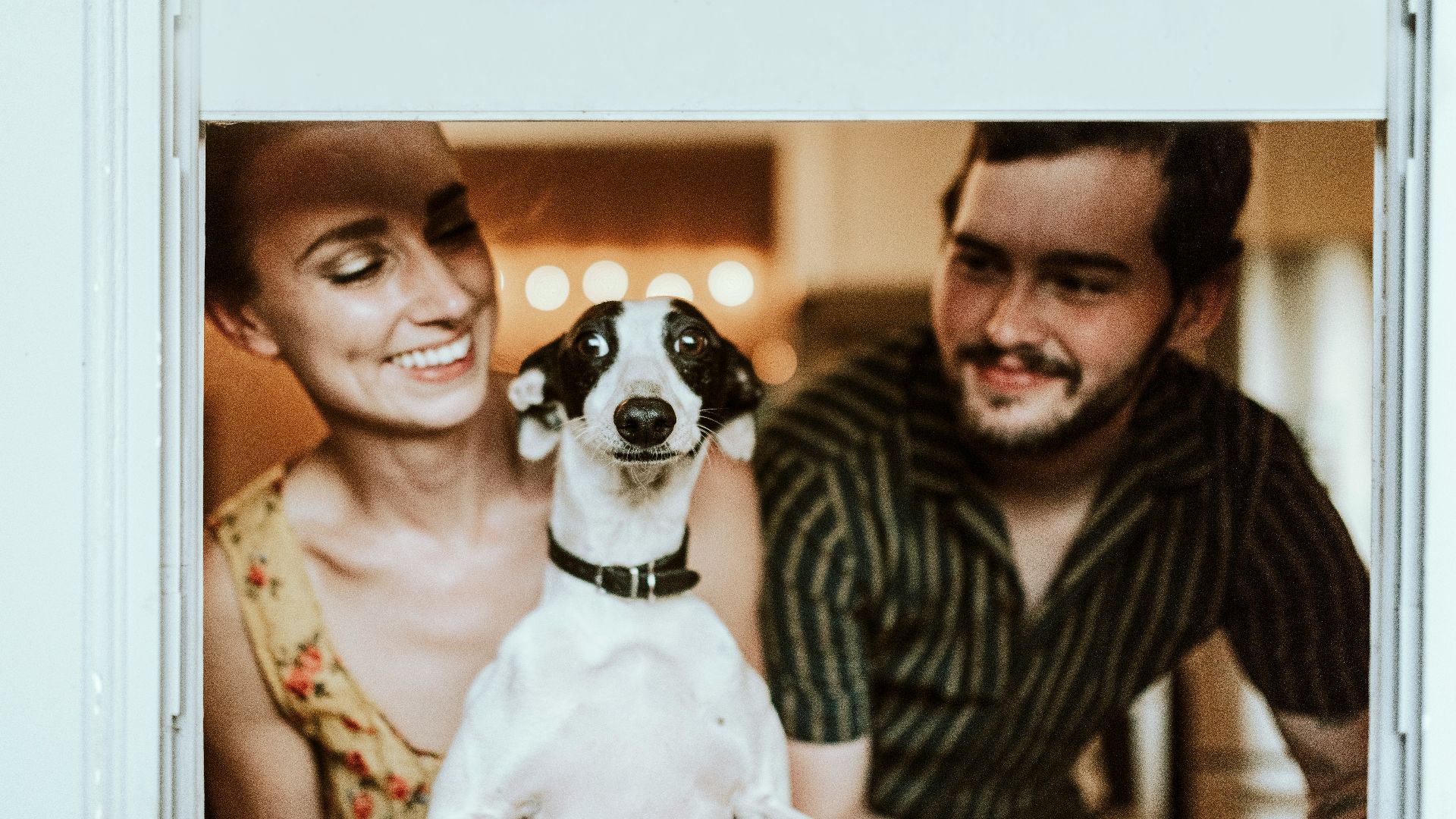 man in black and white striped shirt beside woman in black and white stripe shirt