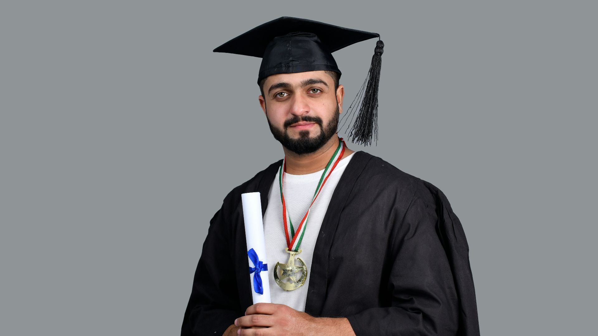 a man wearing a cap and gown