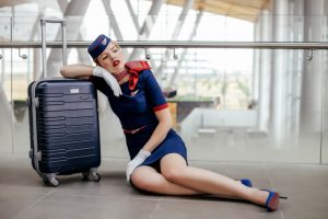 woman-sitting-on-the-floor-beside-black-luggage-2754854-300x200.jpg