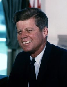1024px-John_F._Kennedy_White_House_color_photo_portrait-231x300.jpg