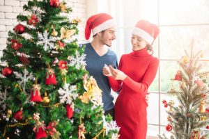 man-and-woman-standing-beside-christmas-tree-3183385-300x200.jpg