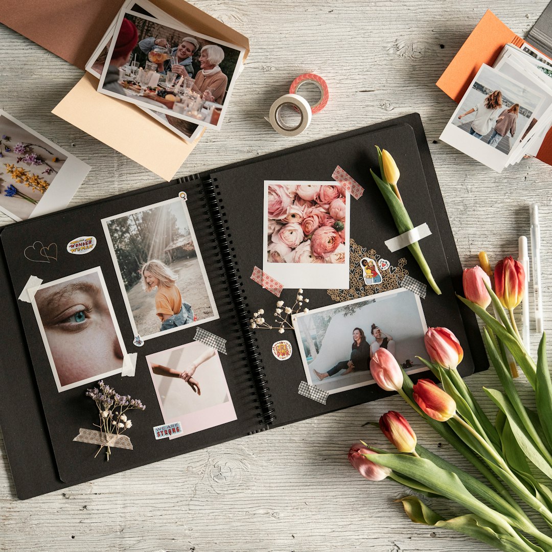 a bunch of pictures and flowers on a table