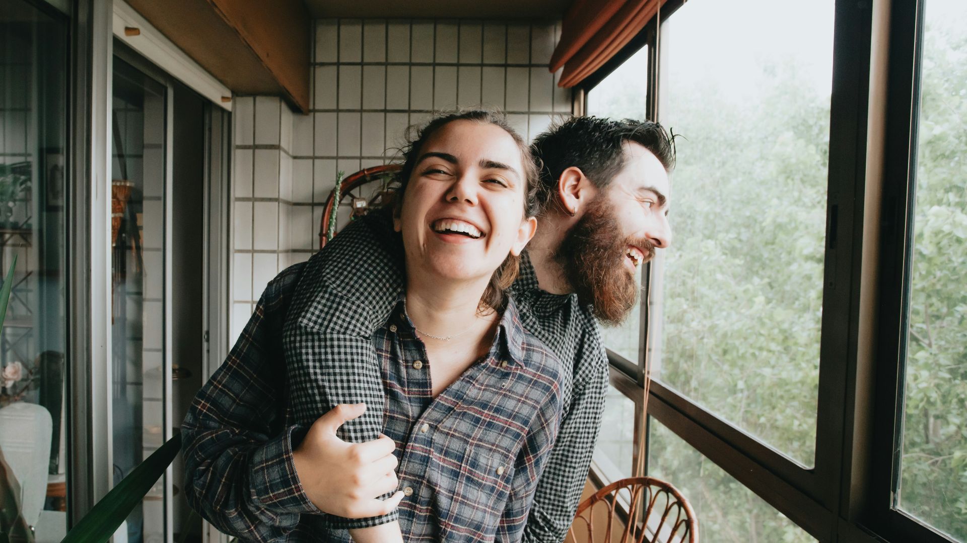 man and woman sitting on chair