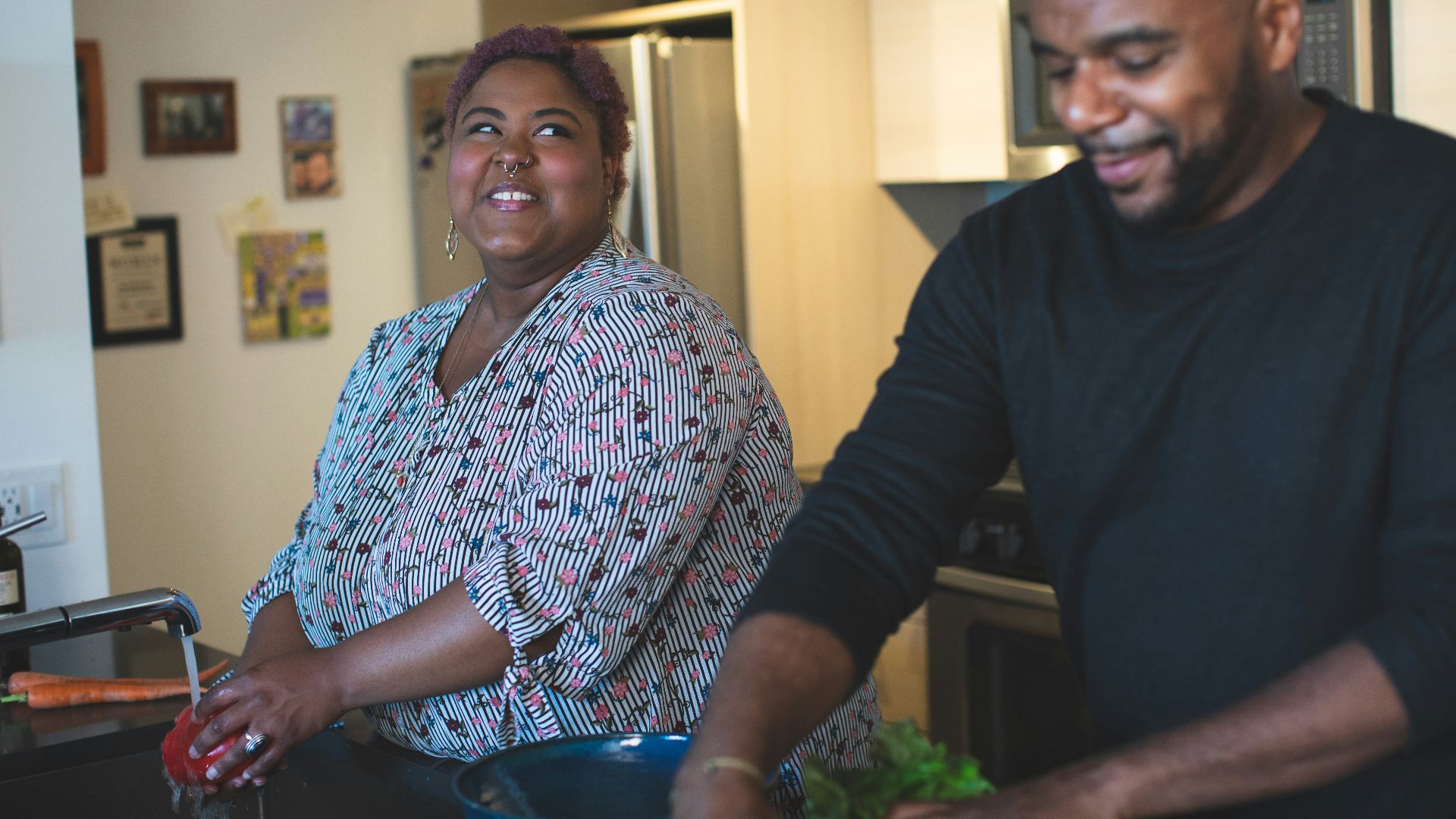 man and woman standing near wall