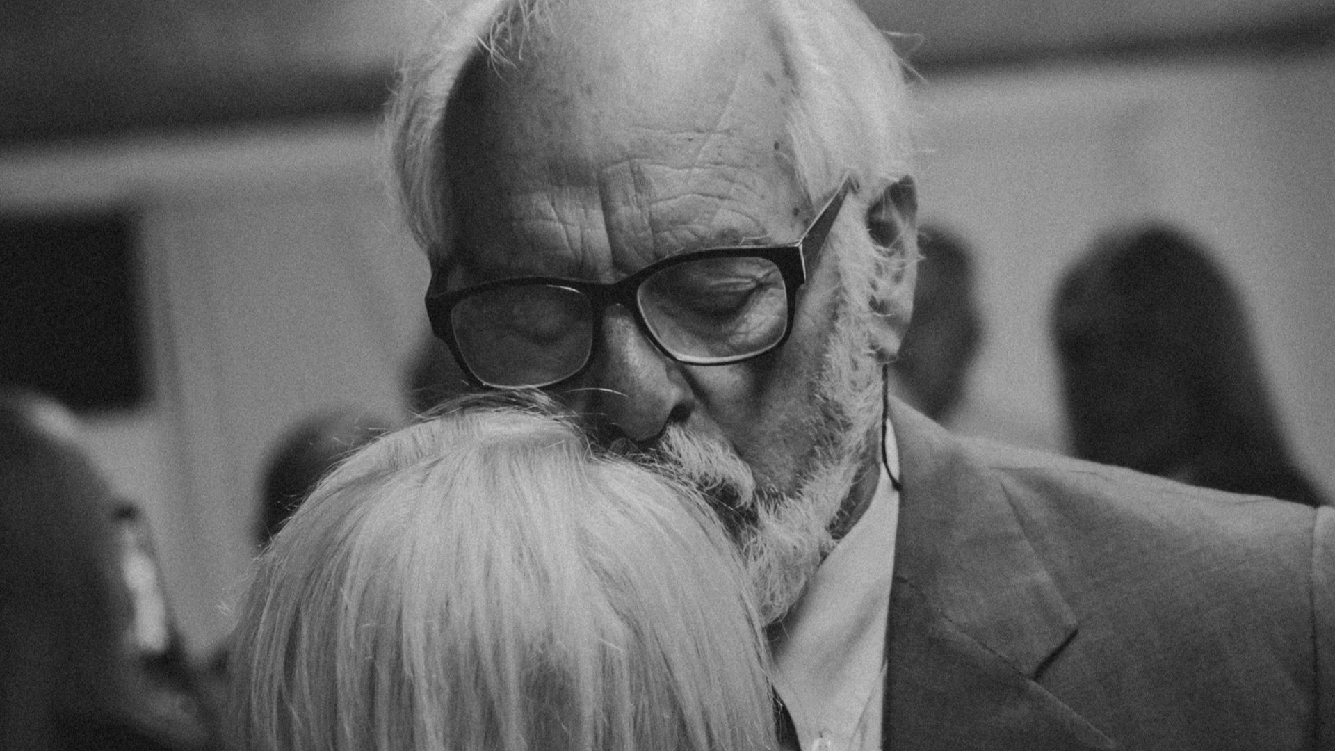 a black and white photo of a man and a woman