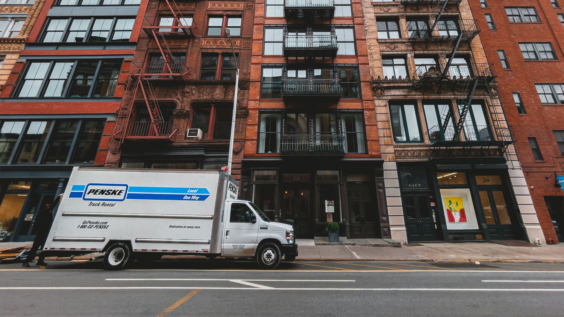 a white truck parked in front of a building