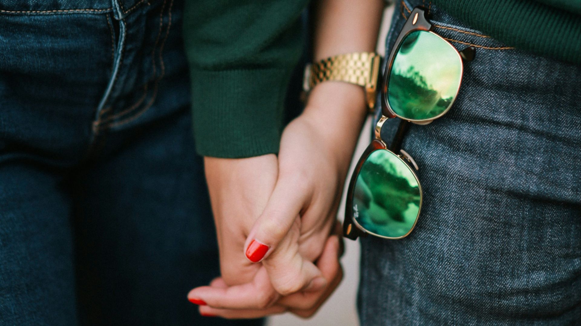 man and woman holding hands
