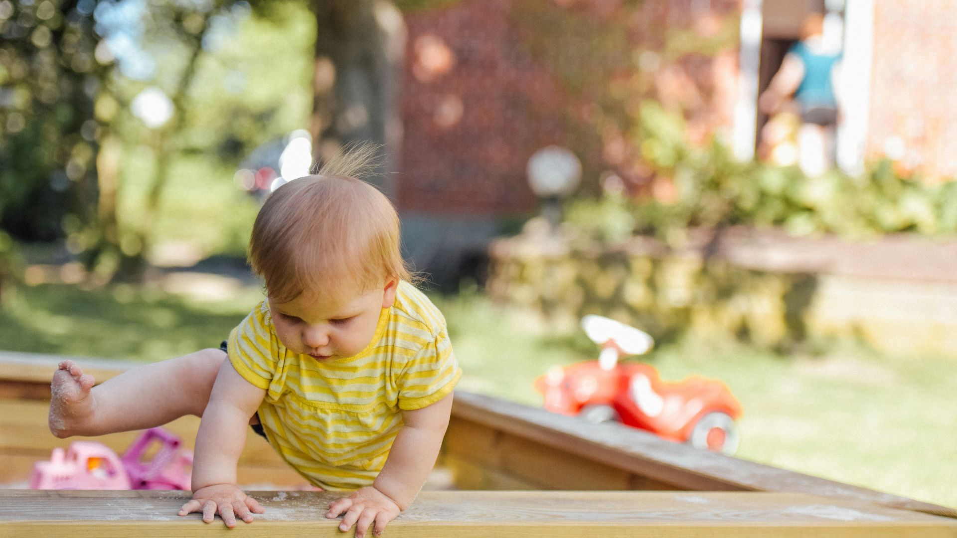 baby trying to get out of his crib