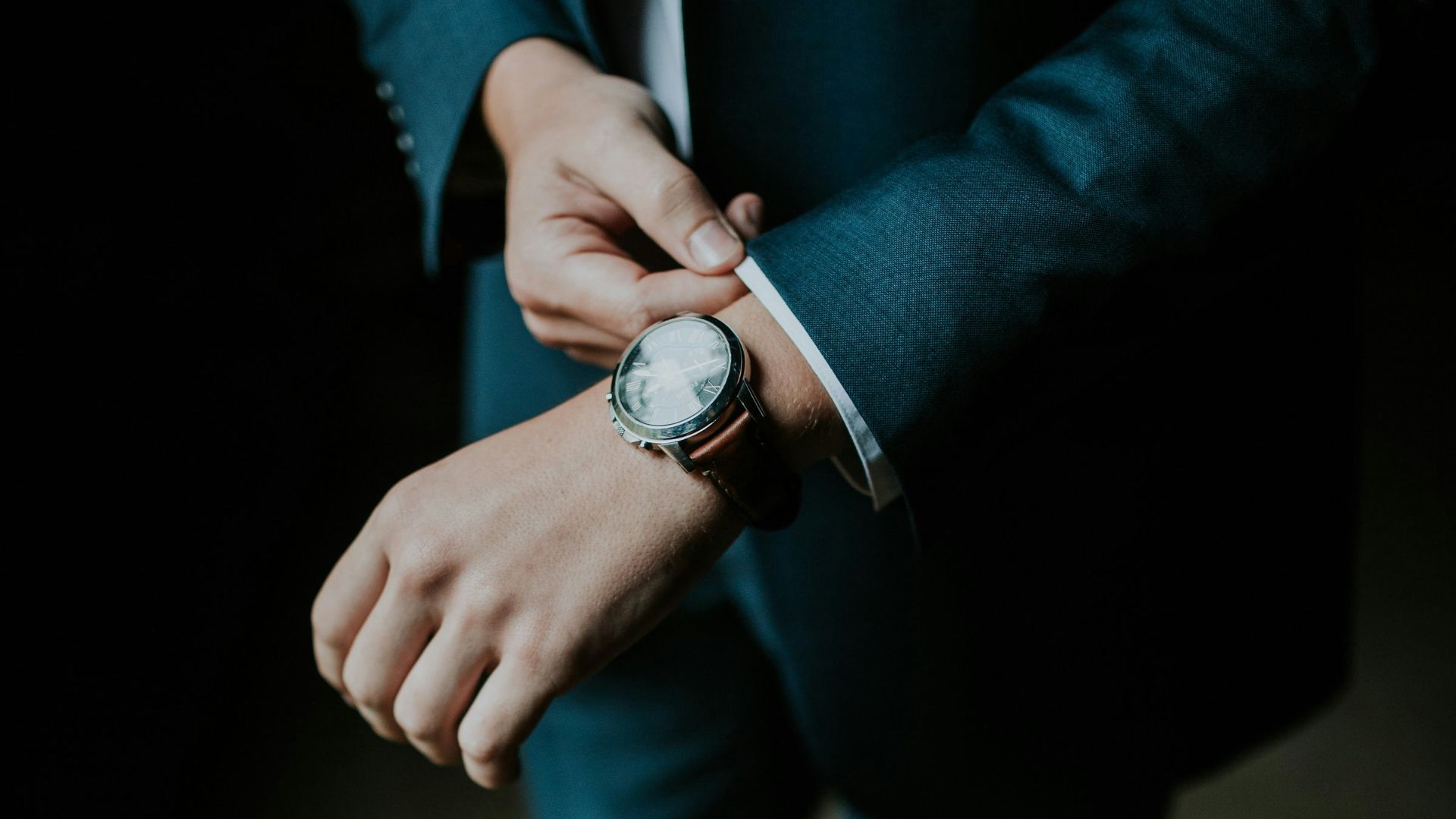 man holding his black suit
