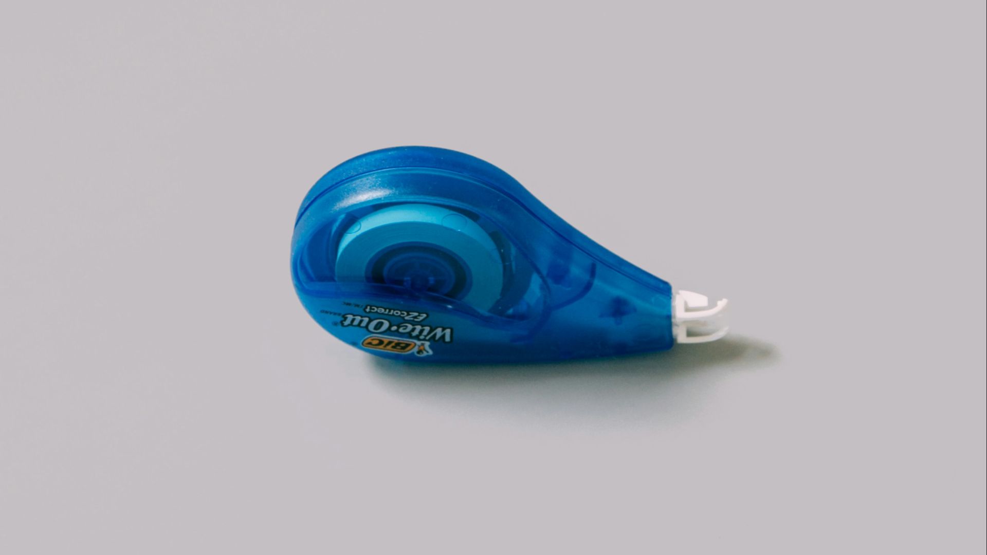 blue plastic bottle on white table