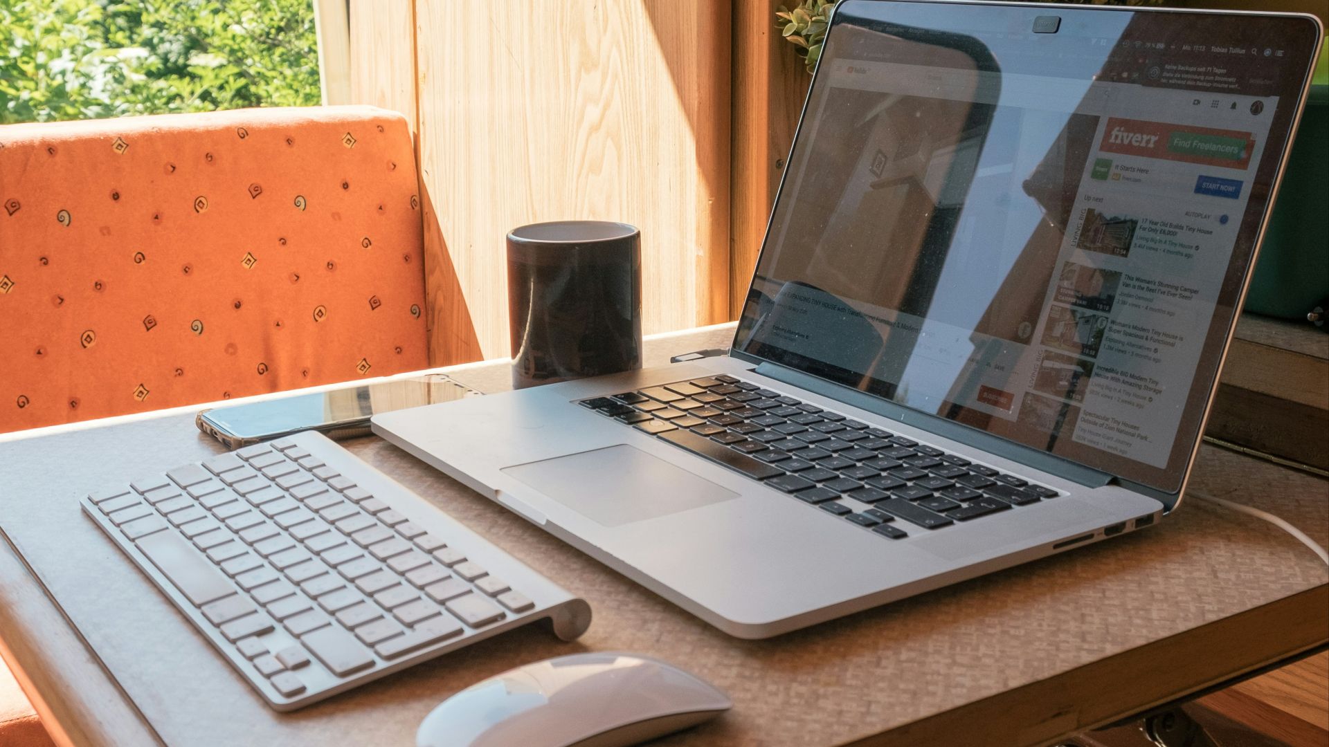 macbook pro on brown wooden table
