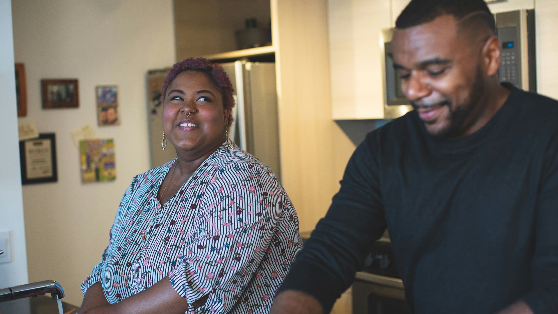 man and woman standing near wall