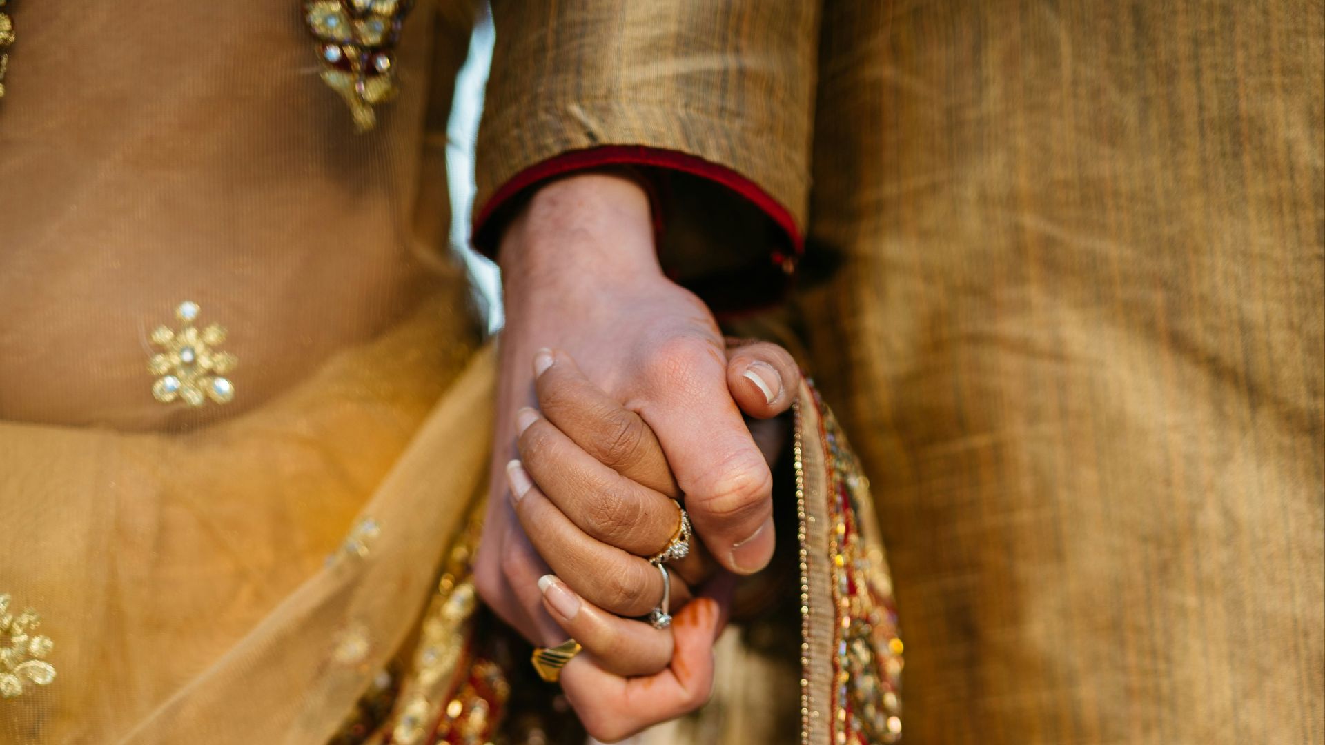 selective focus of two person holding hands