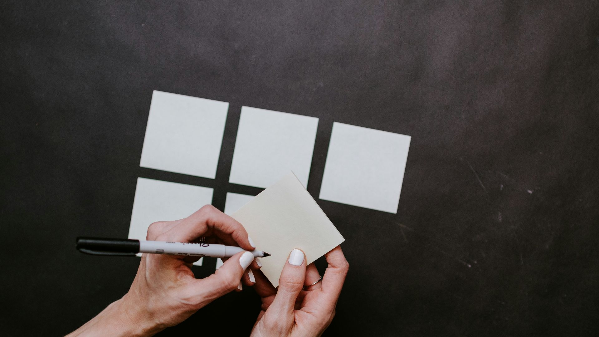 person holding white printer paper