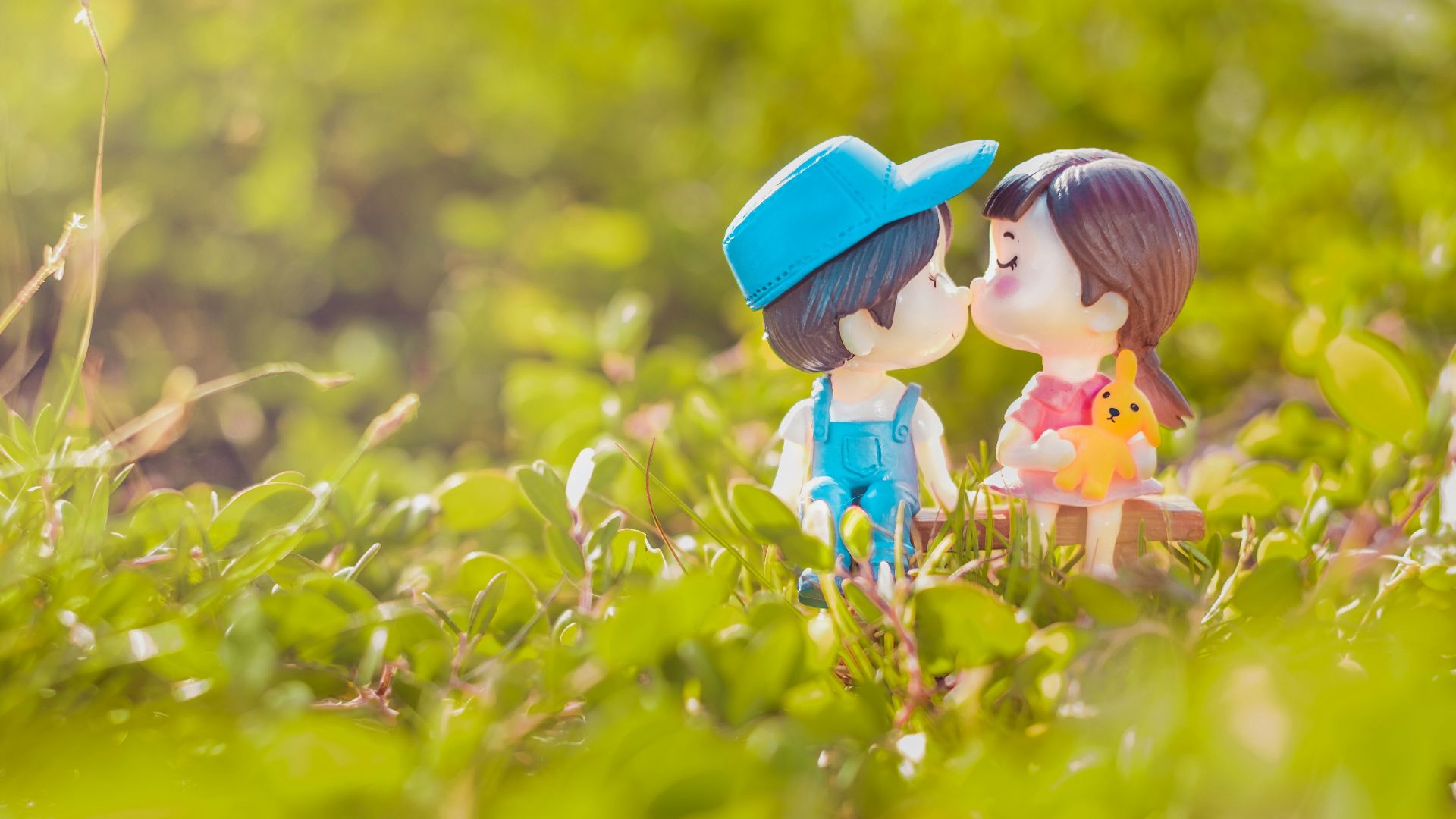 girl in blue hat on yellow flower field during daytime