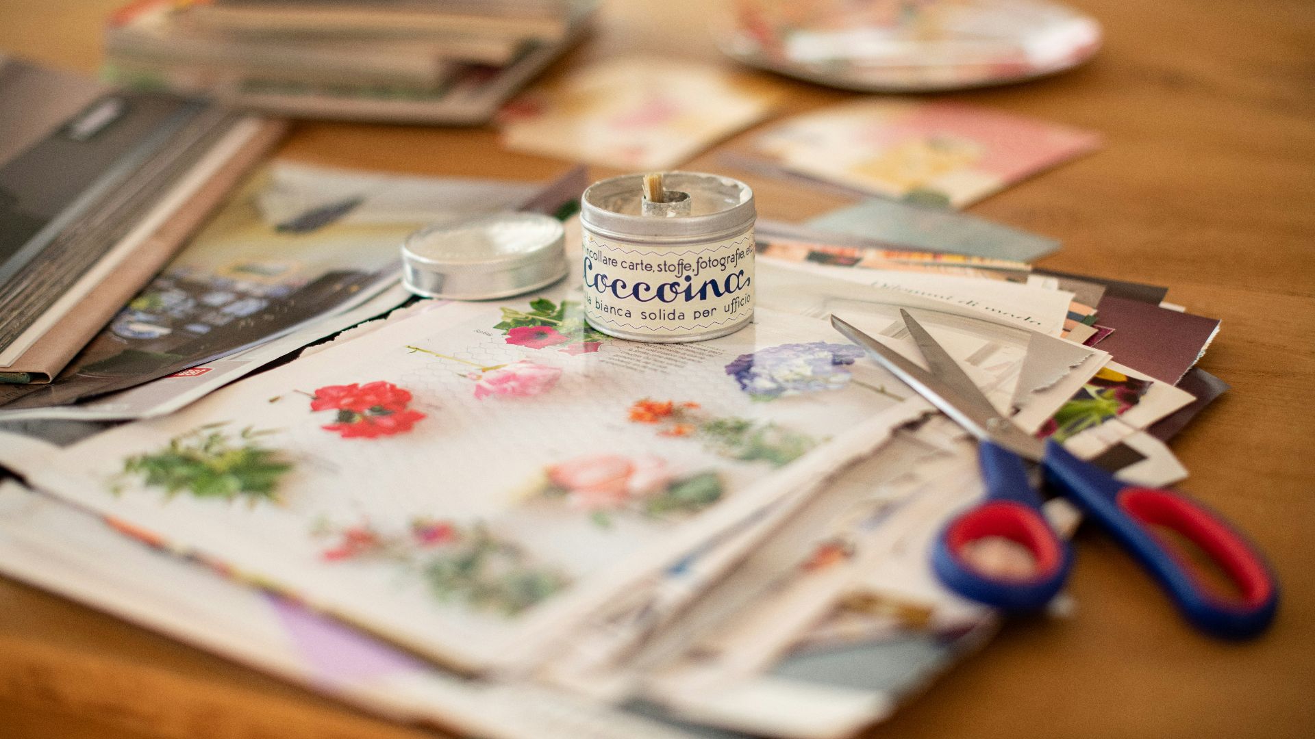 silver fork and knife on white and red floral table cloth