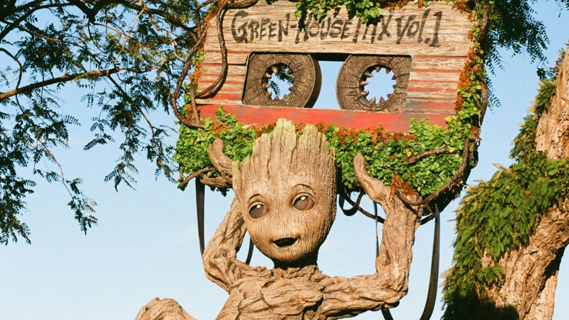 a statue of a groote holding up a radio