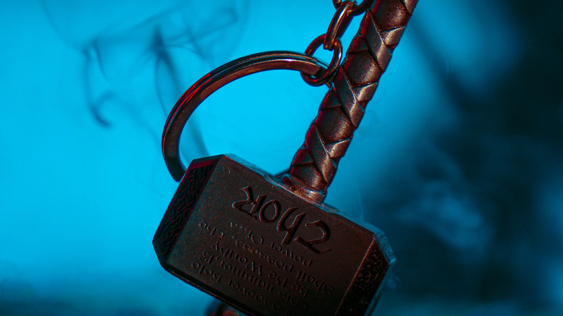 a metal hook with a sign on it