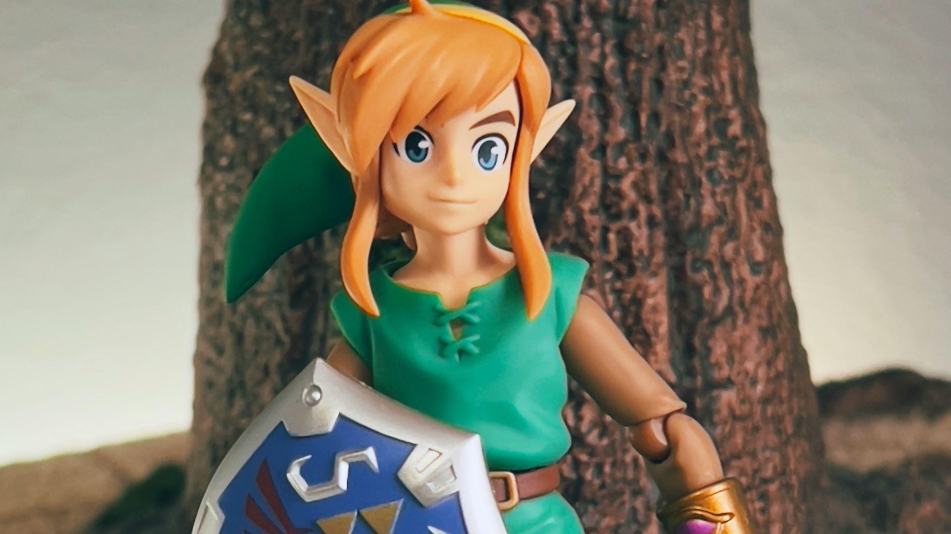 a toy girl holding a sign