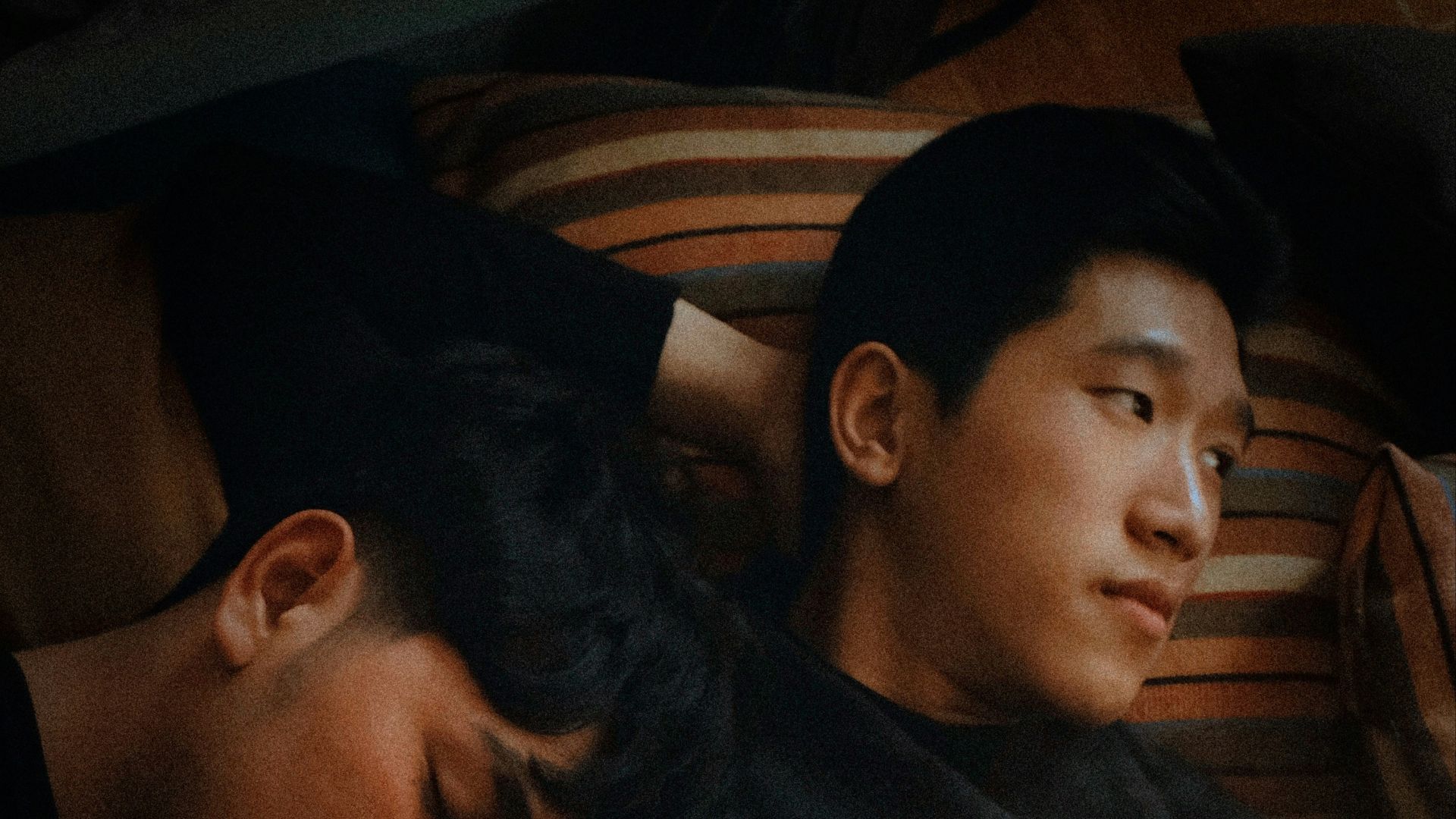 man lying beside man