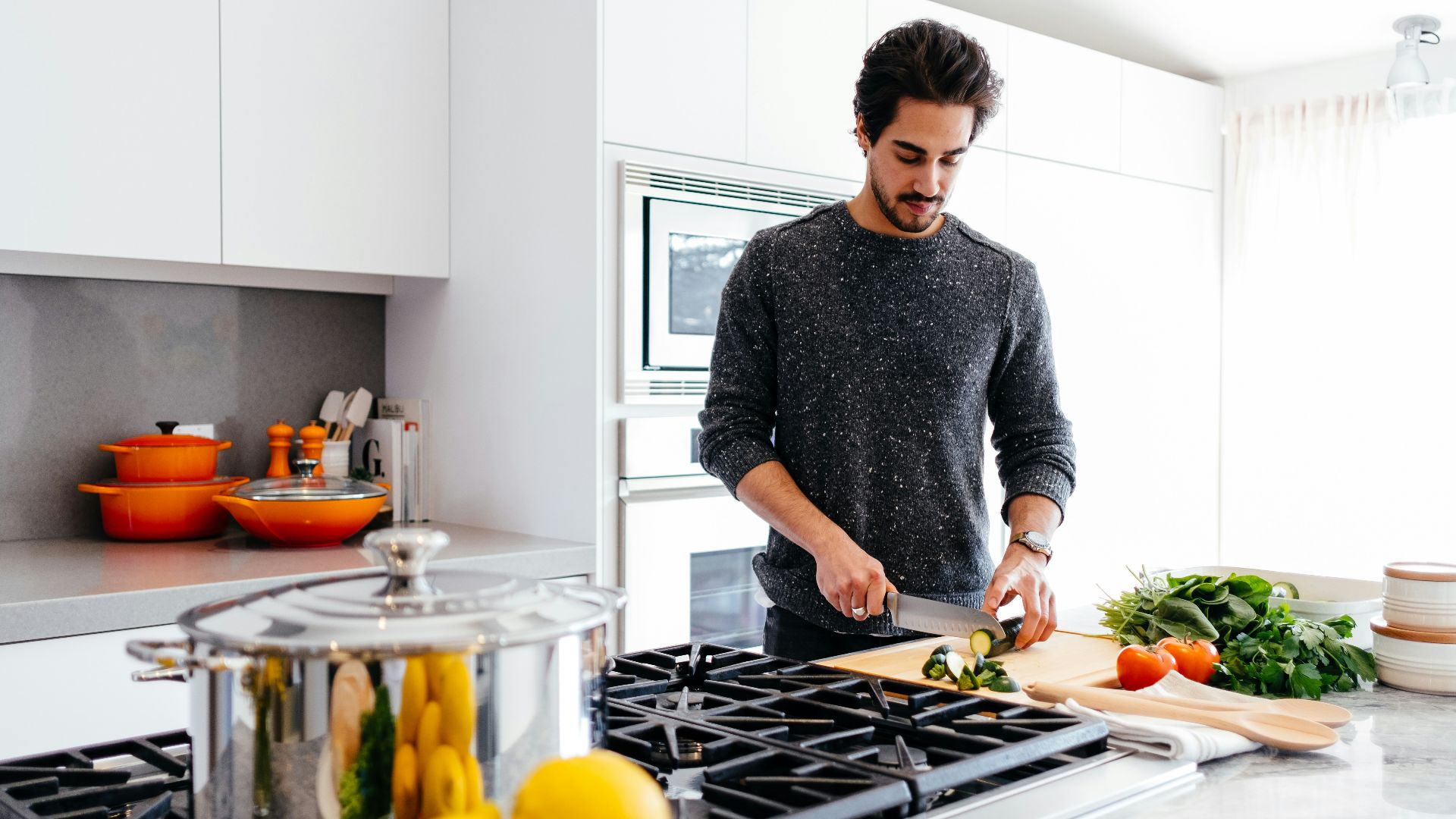 man cutting vegetables