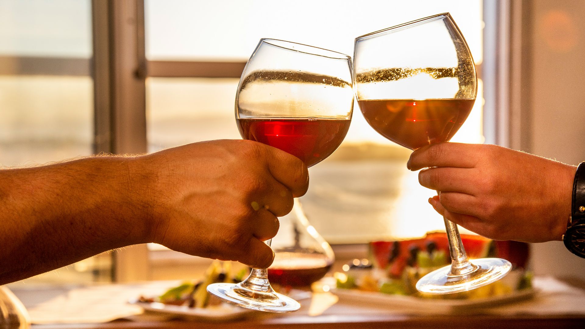 3 person holding wine glasses