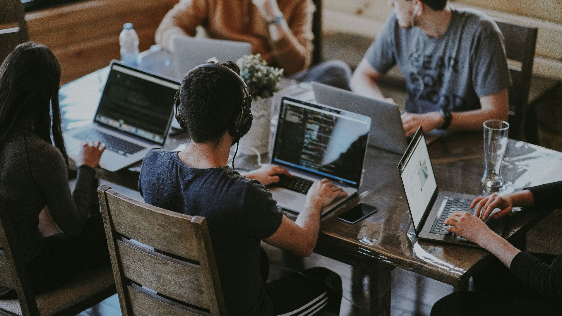 group of people using laptop computer