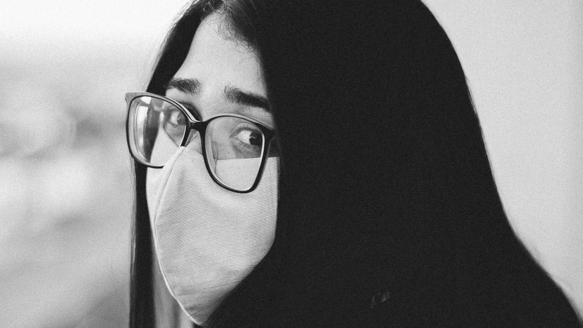 woman wearing black hijab and black framed eyeglasses