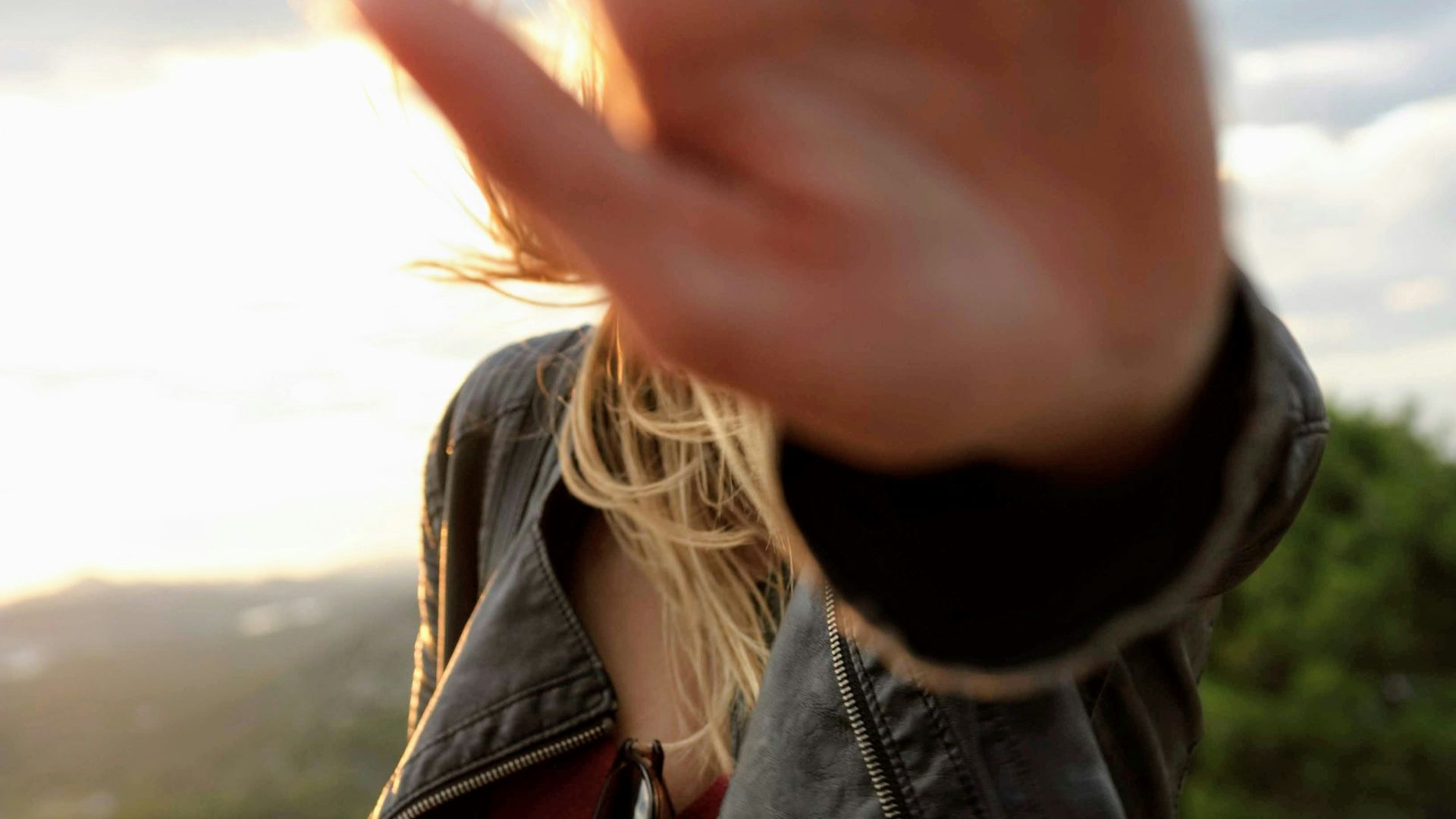 person in black jacket in selective focus photography