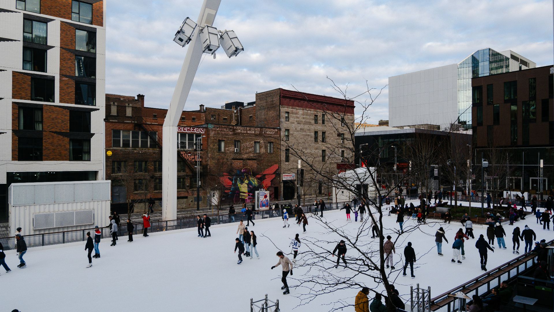 a group of people skating on an ice rink
