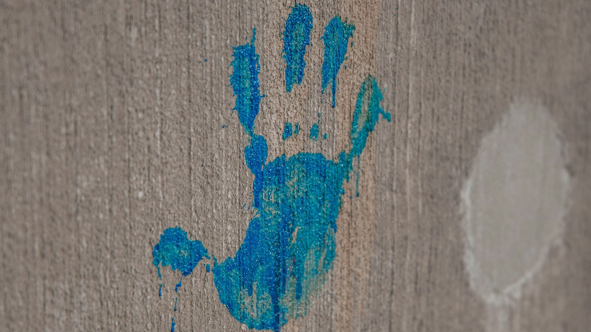 blue heart drawing on brown wooden surface