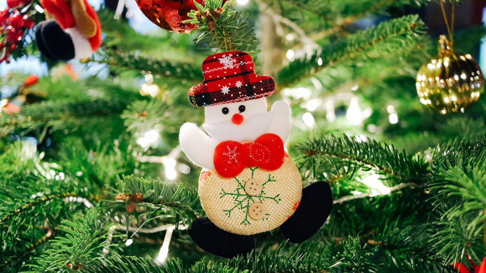 selective focus photography of snowman Christmas ornament