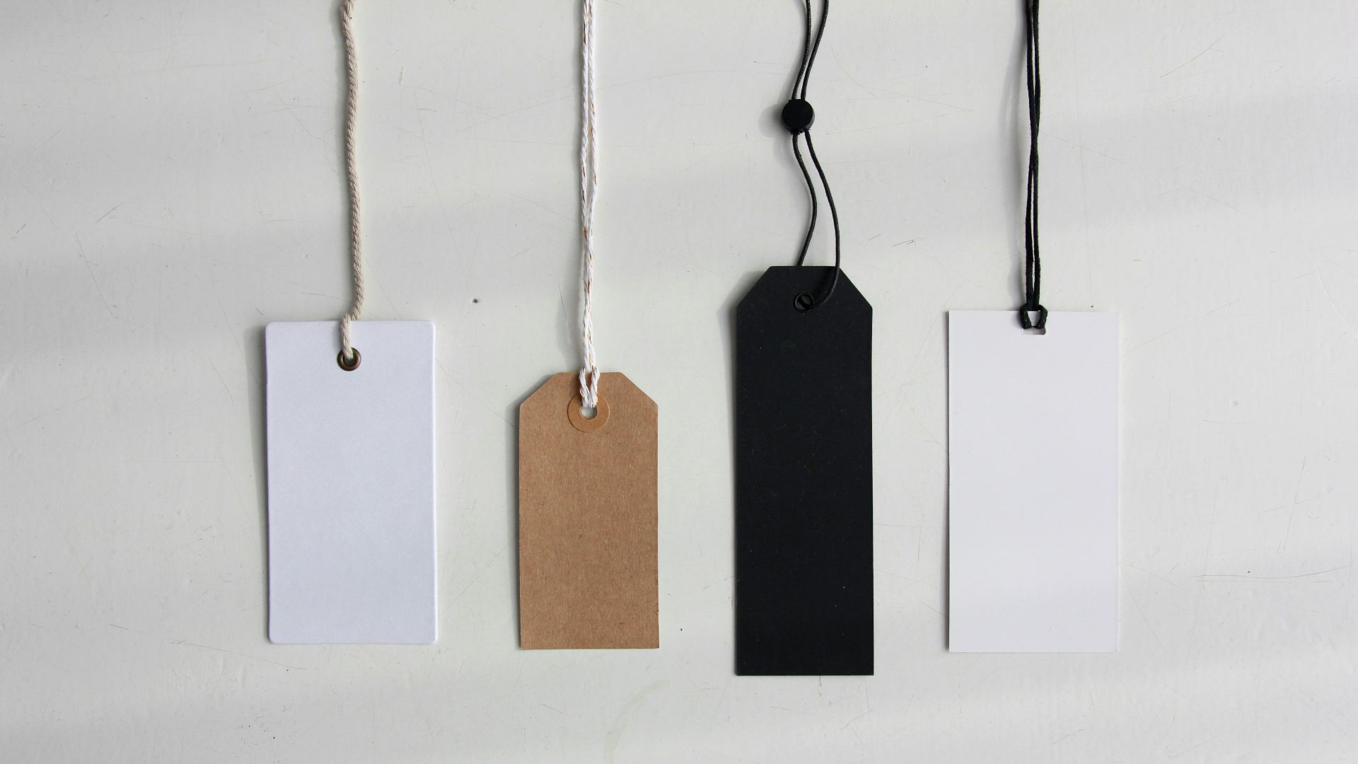 four paper card tags
