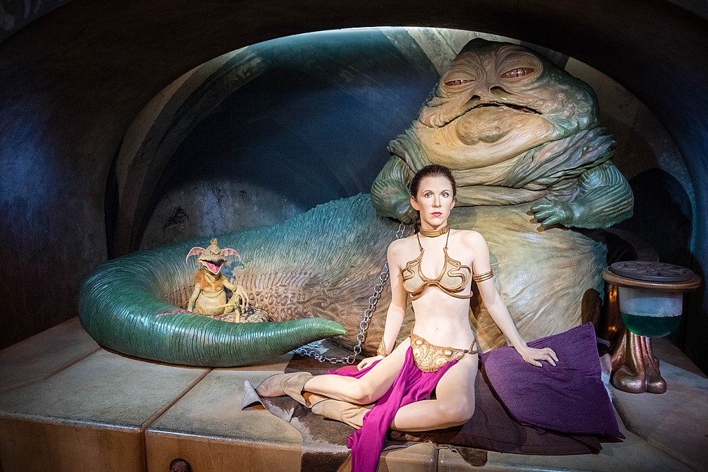 1024Px-Carrie Fisher As Princess Leia Organa With Jabba The Hutt And Salacious B. Crumb (33726767023)