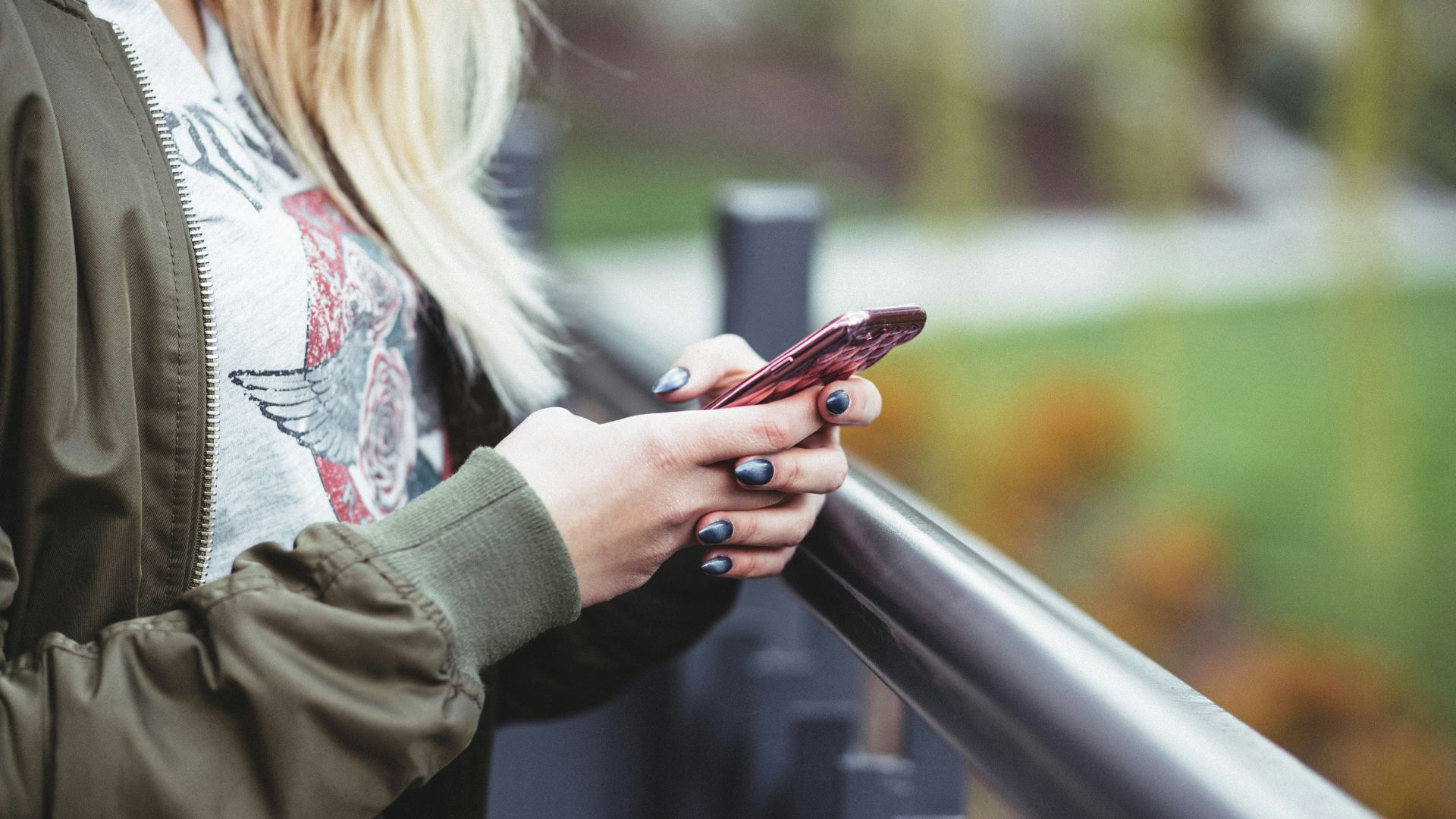 woman holding red phone