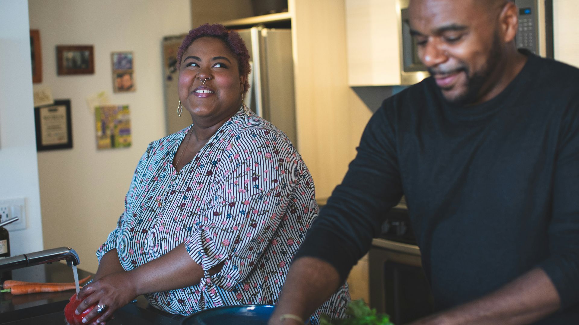 man and woman standing near wall