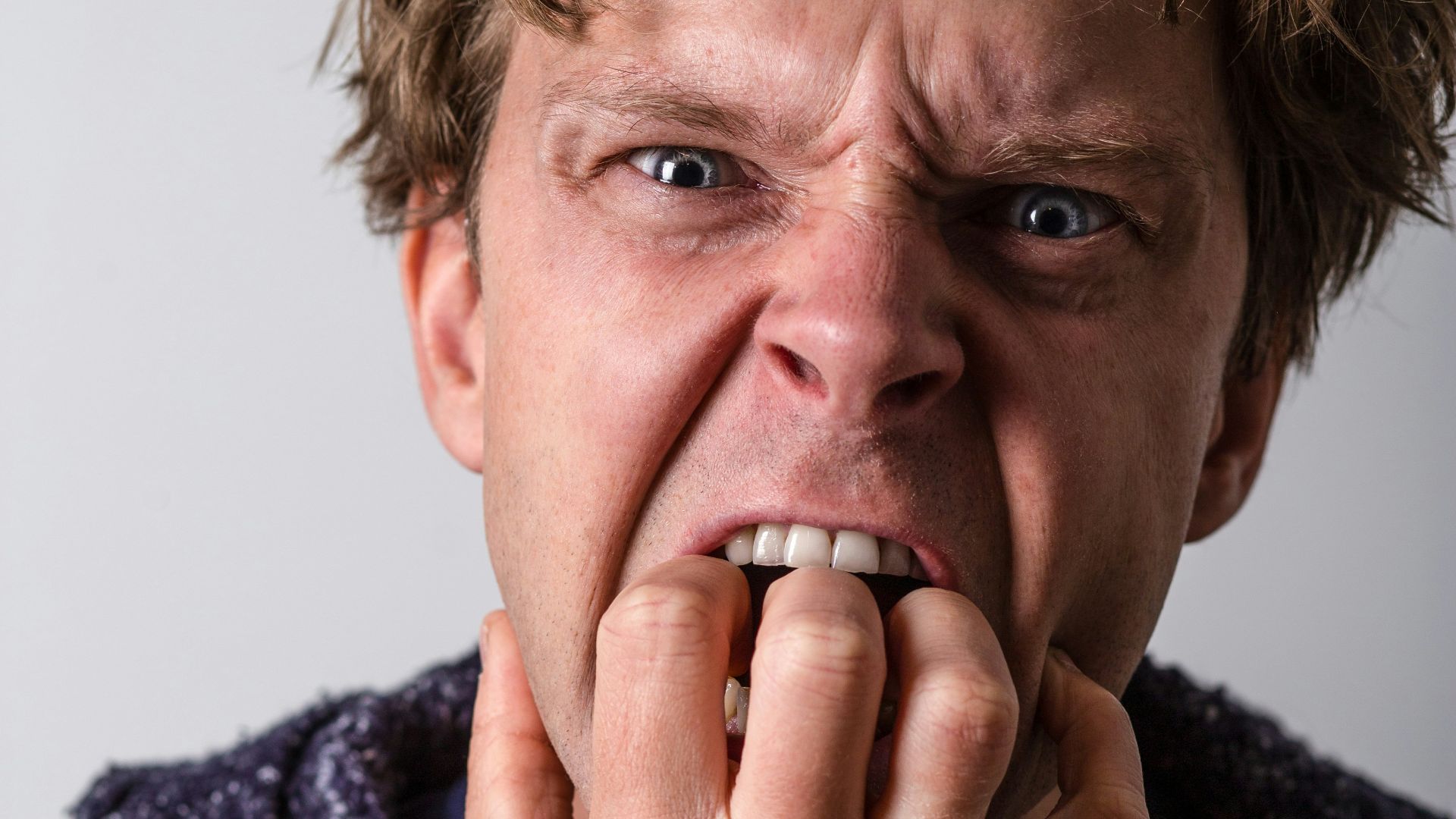 man in blue and white long sleeve shirt