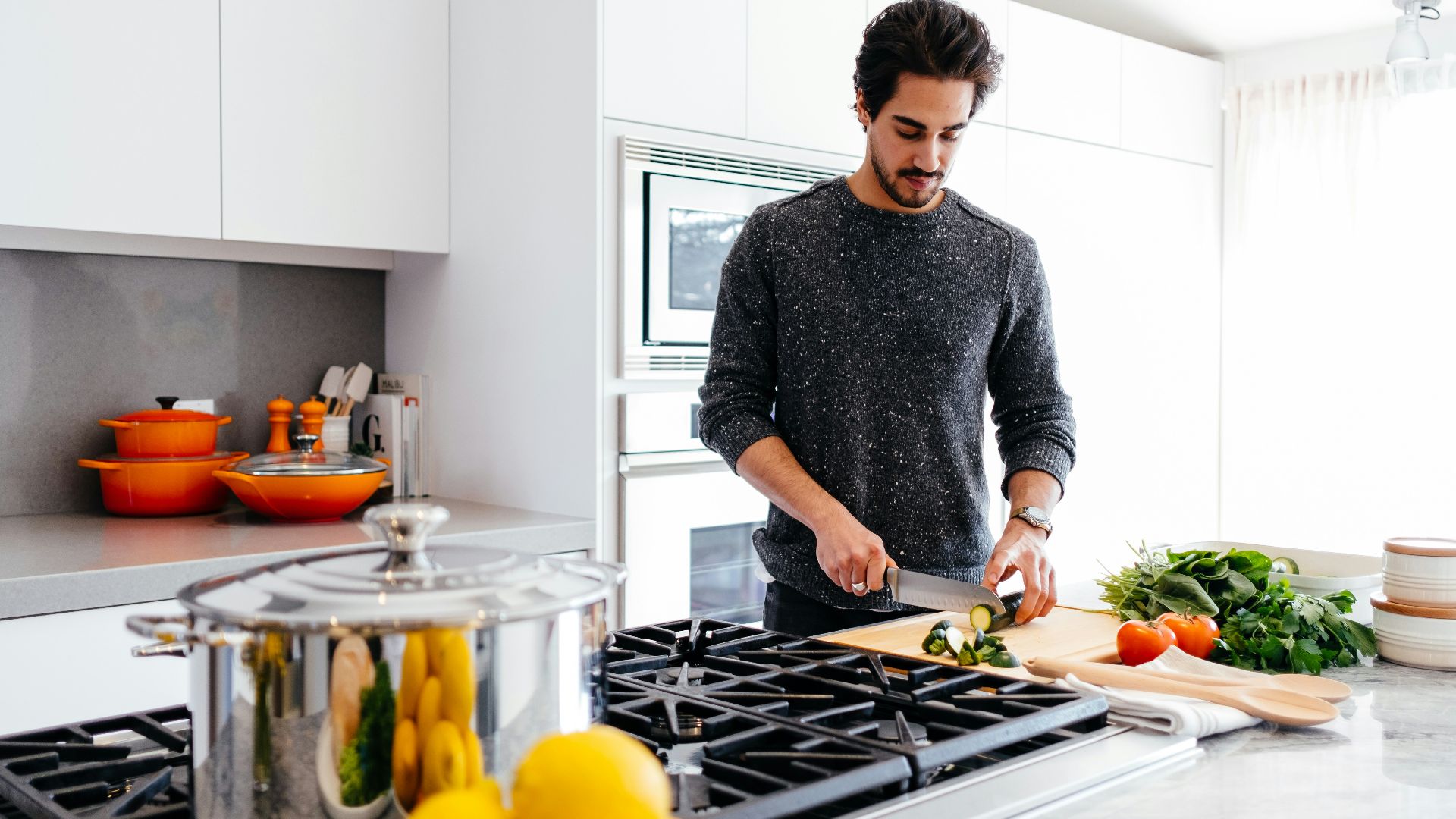 man cutting vegetables
