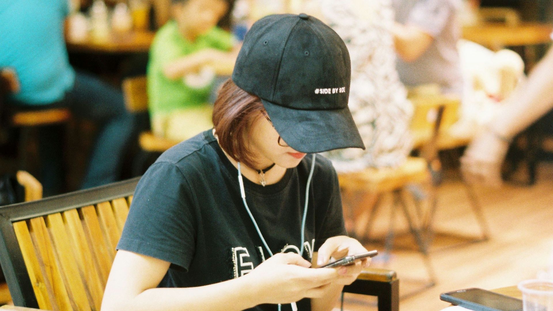 woman sitting on brown bench