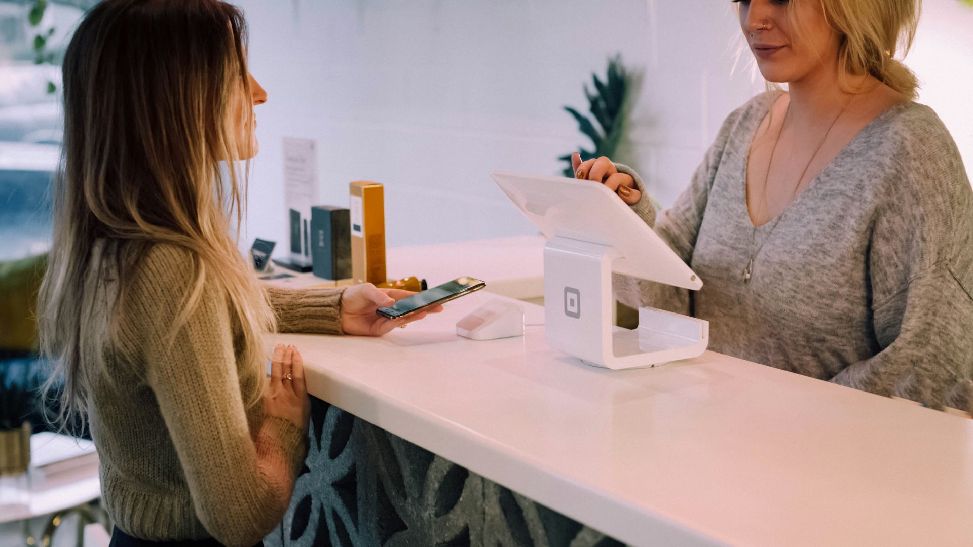 woman standing near monitor