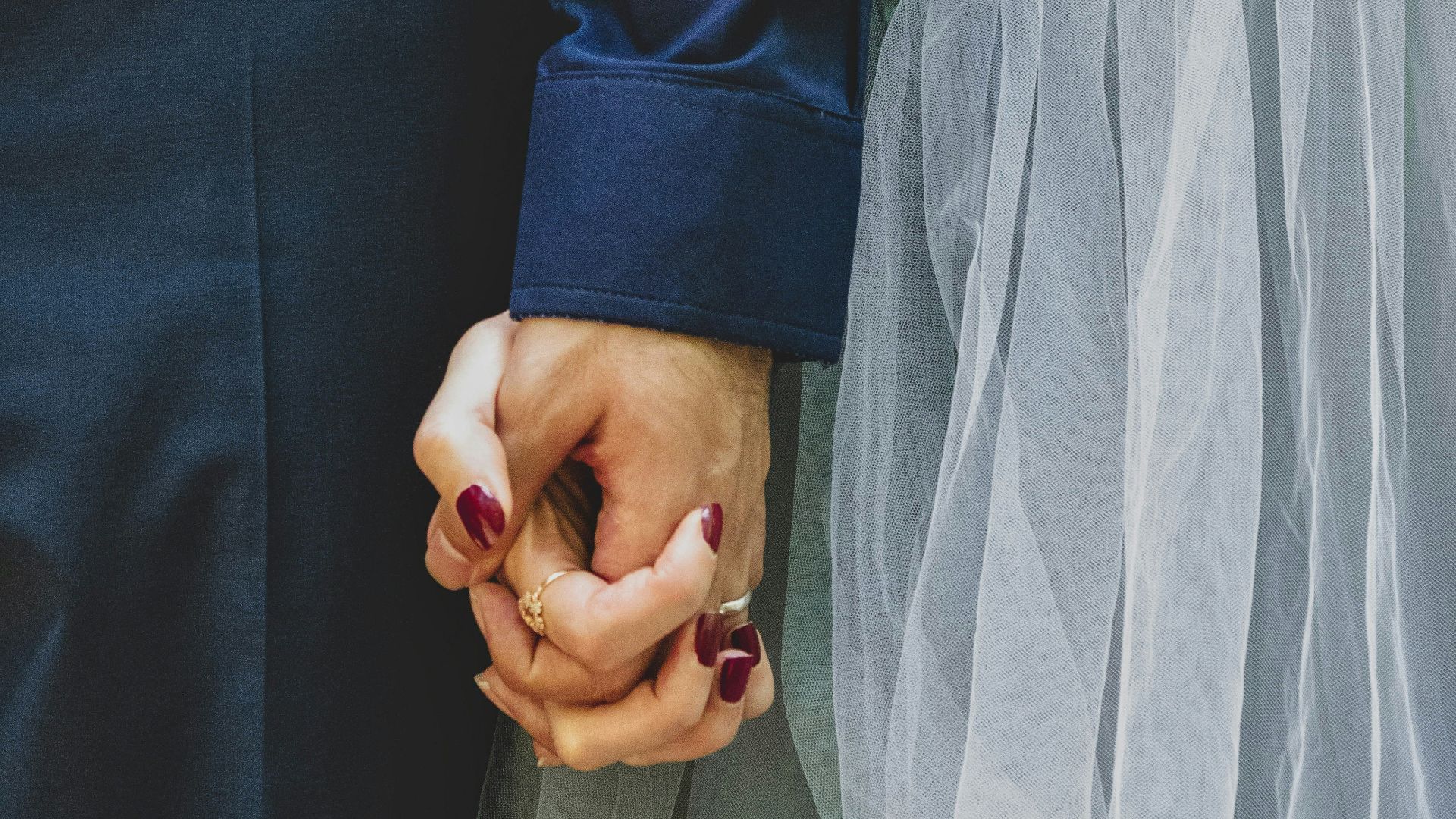 man and woman holding hands