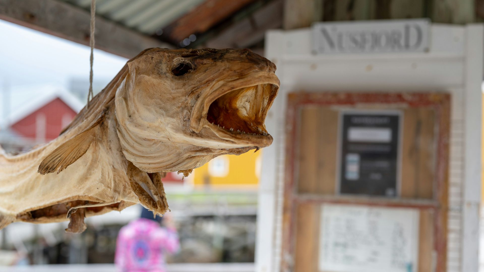 a wooden sculpture of a fish with its mouth open