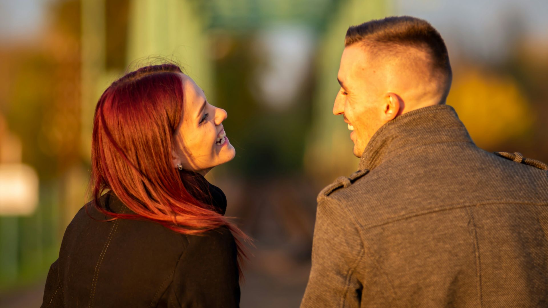 man and woman standing side by side during daytime