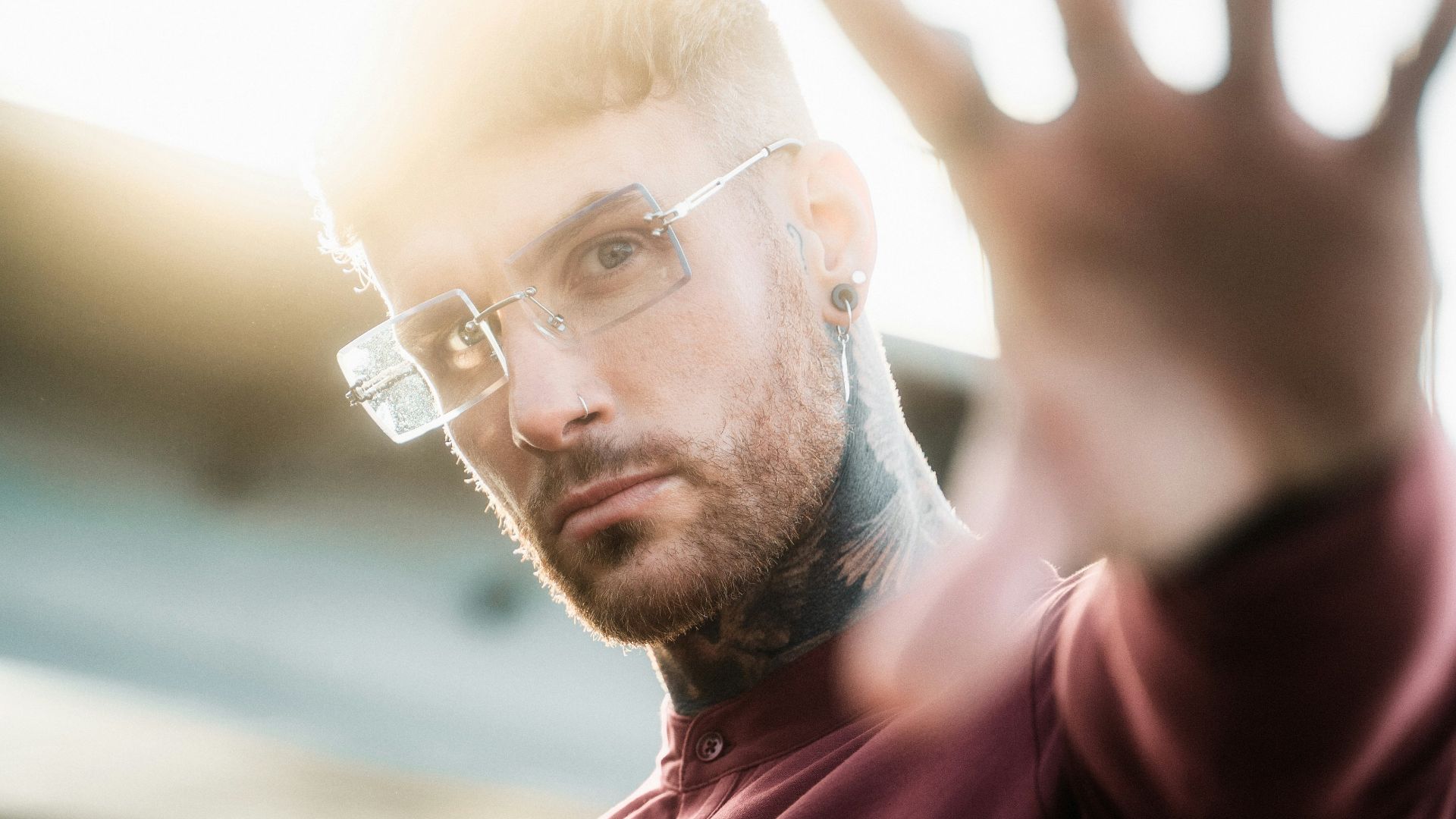 man in red polo shirt wearing eyeglasses