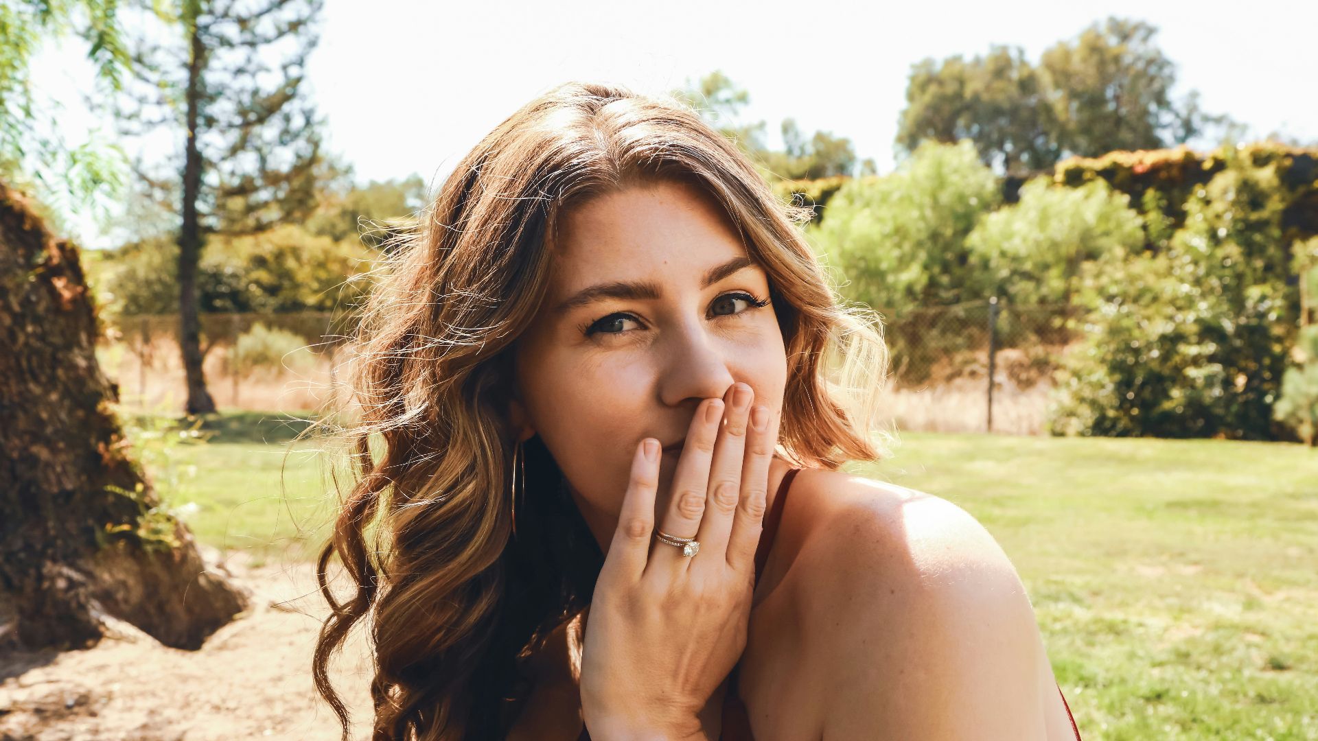 a woman with her hand on her face