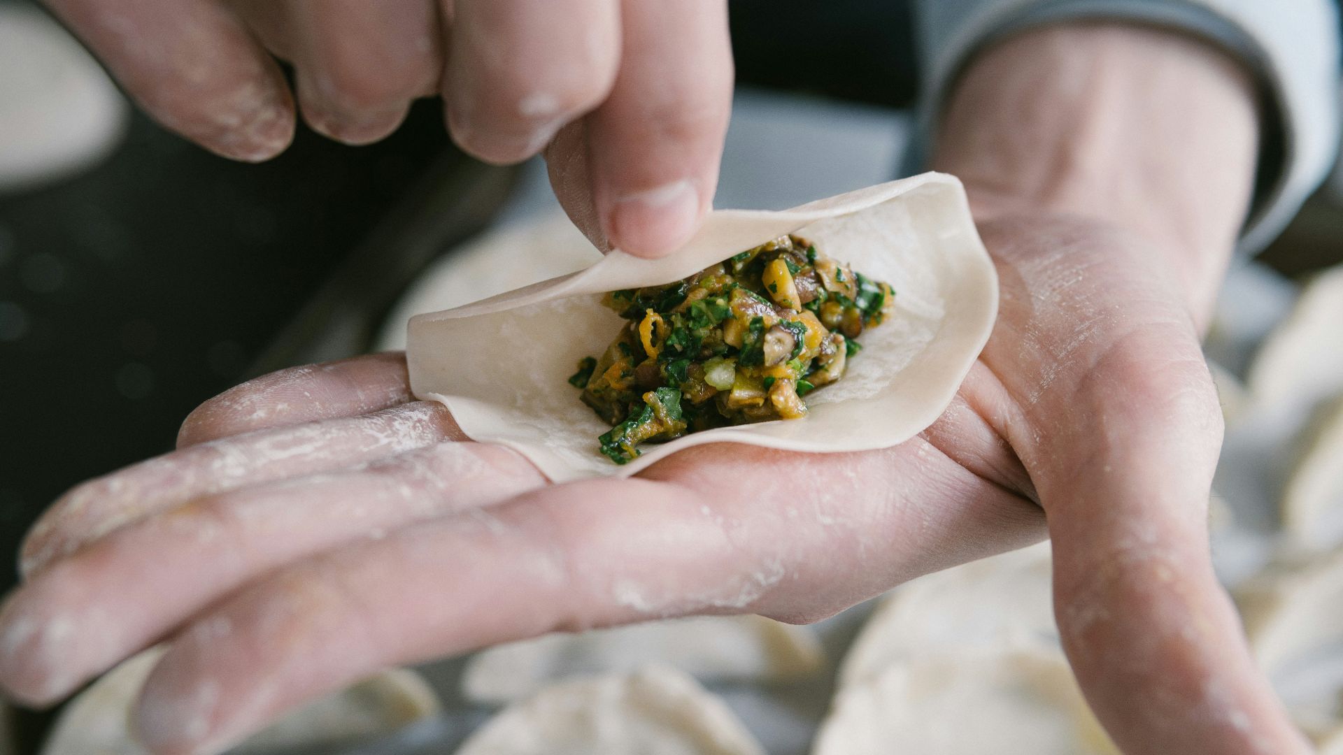 person holding white ceramic plate with food