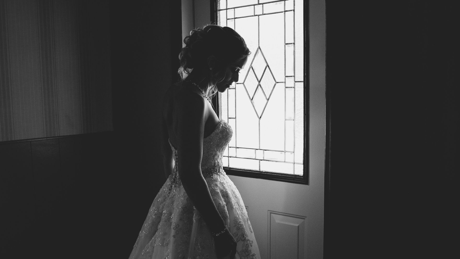 woman standing behind the door