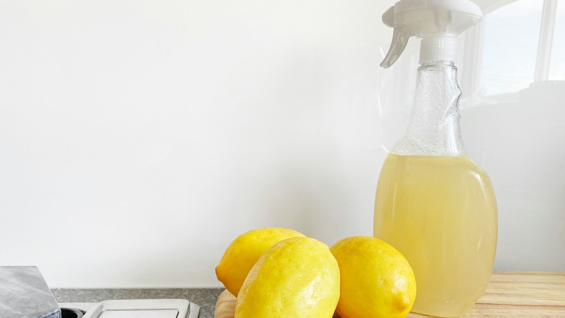 yellow lemon fruit beside clear glass bottle